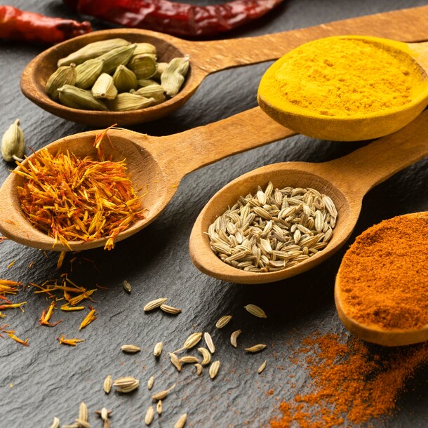 high-angle-indian-spices-with-spoons 1